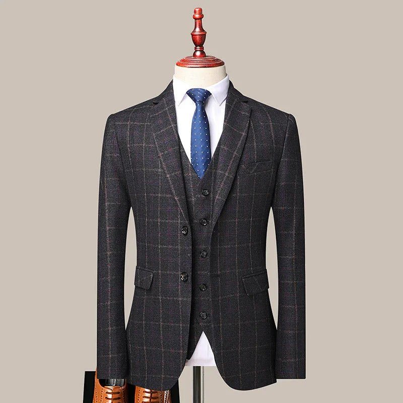 Men's dark plaid suit with waistcoat, white dress shirt, and blue polka dot tie on mannequin