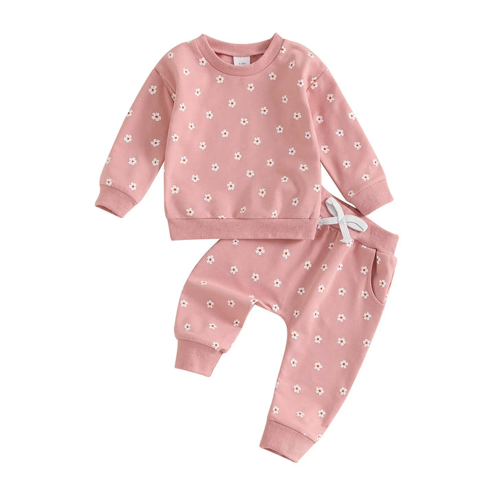 Pink baby two-piece outfit with white daisy flower pattern, long sleeve top and pants with drawstring