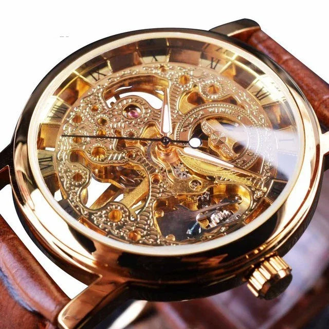 Close-up of luxury gold skeleton mechanical wristwatch with brown leather strap and Roman numerals