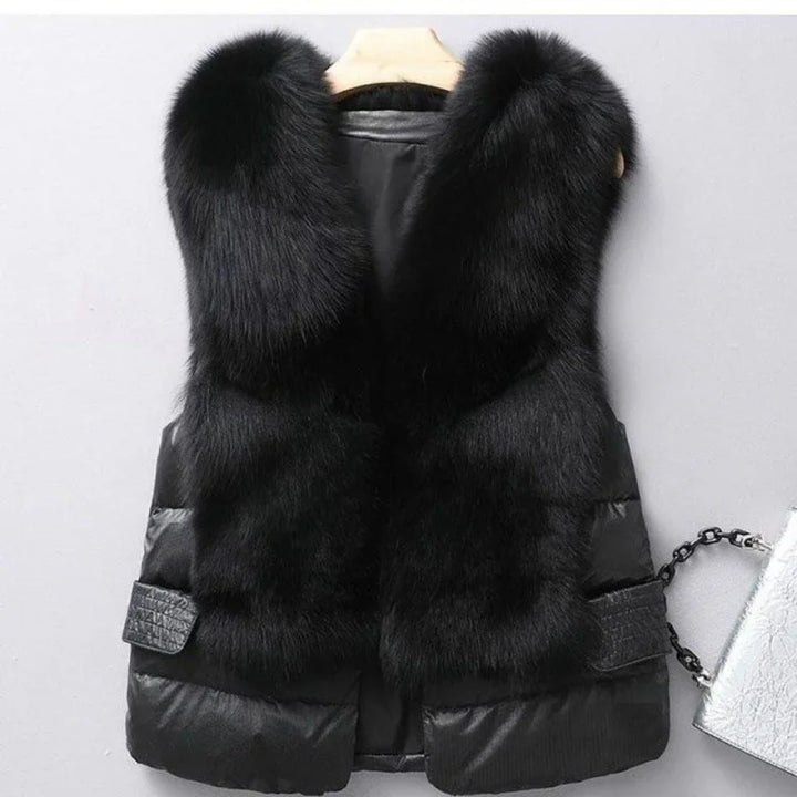 Black fur vest with padded sides and croc-texture pocket flaps on a hanger
