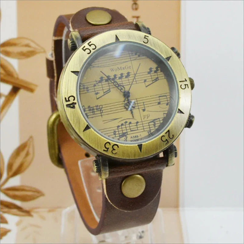 Vintage wristwatch with brass bezel and musical notes dial on brown leather strap