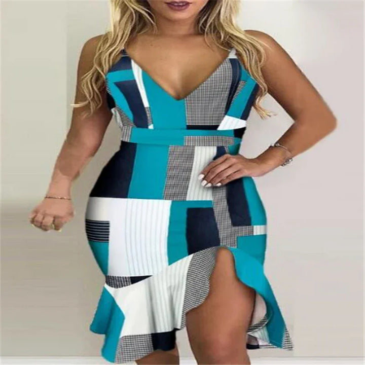 Woman wearing teal, white, and black geometric print sleeveless dress with a thigh-high ruffle slit
