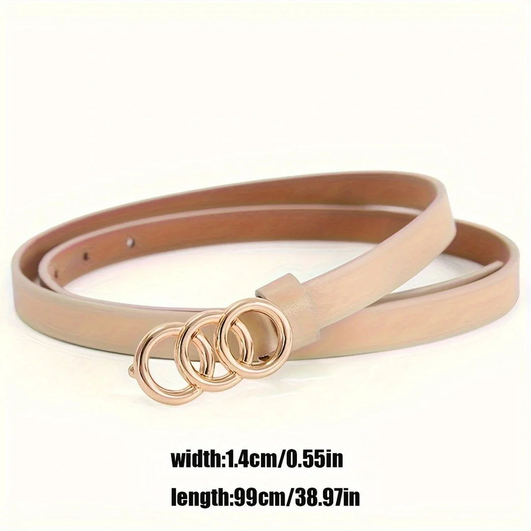 Slim beige leather belt with triple gold circular buckle on white background