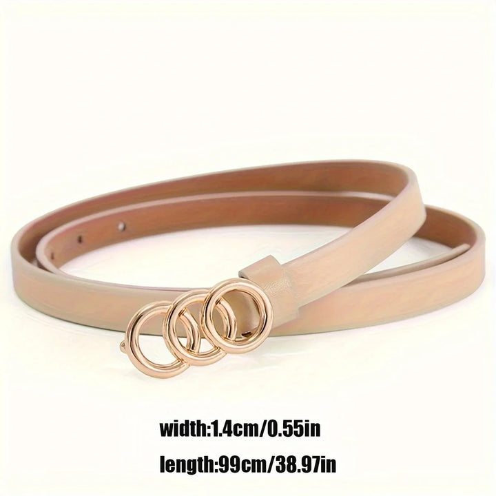 Slim beige leather belt with triple gold circular buckle on white background