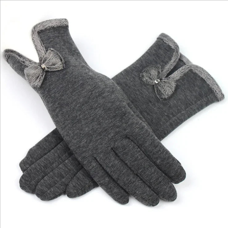 Pair of gray winter gloves with knit trim and small decorative bow detail
