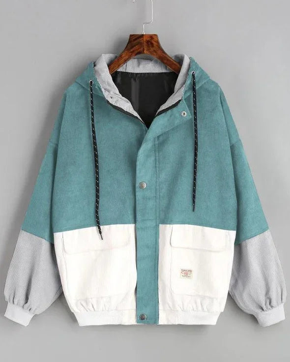 Corduroy hooded jacket with teal upper, white pockets and gray sleeves, casual style