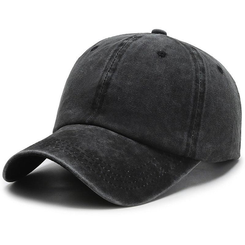 Black washed cotton baseball cap with curved brim and stitched detailing