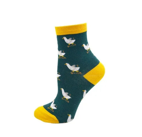 Green ankle socks with yellow cuff, heel, and toe featuring white goose pattern