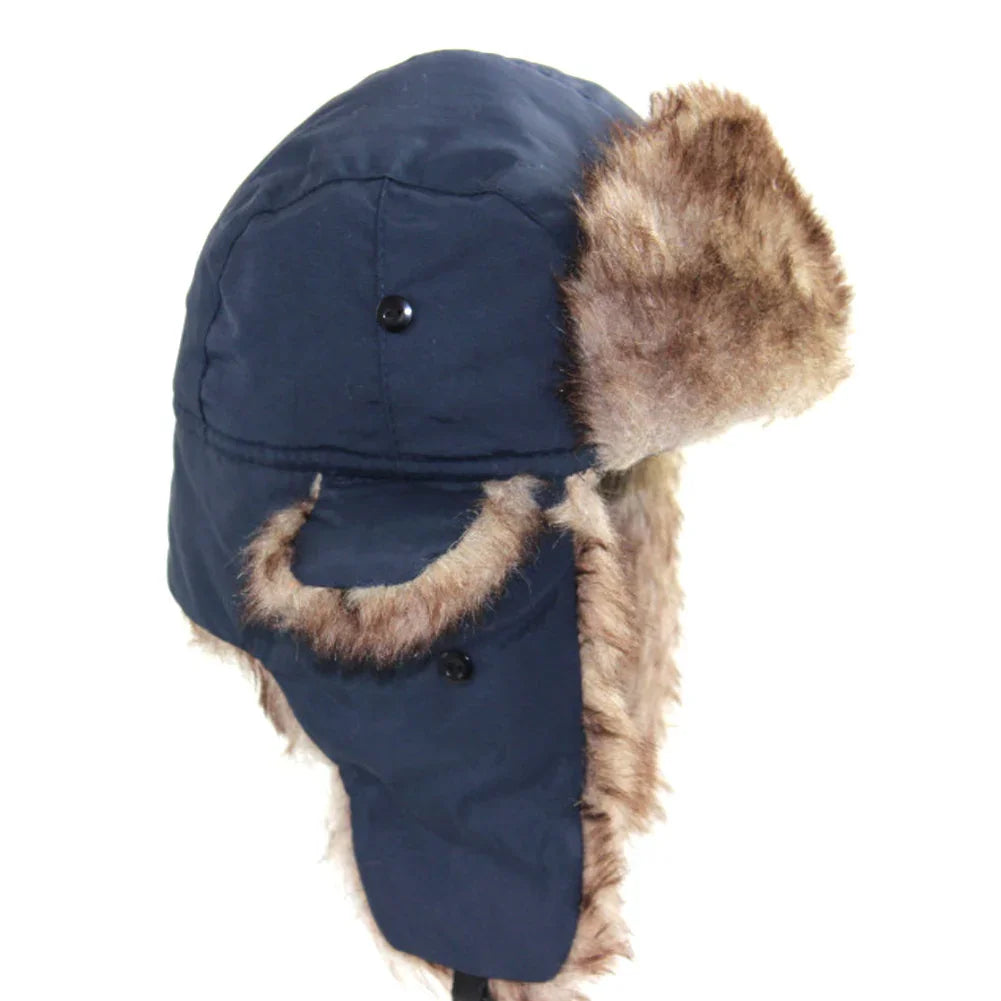 Navy blue winter trapper hat with brown faux fur lining and ear flaps