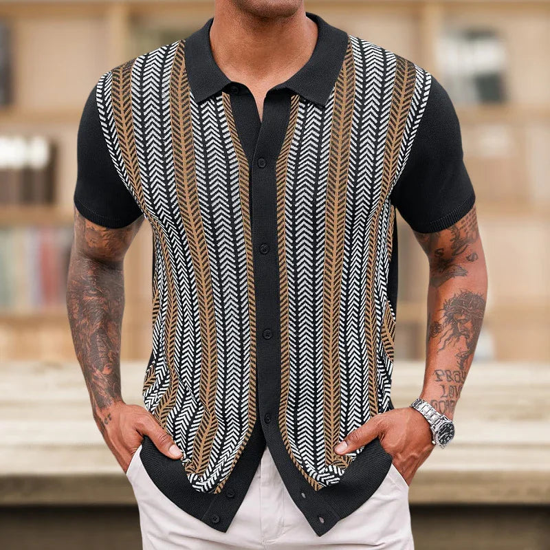Man wearing short sleeve button-up shirt with black, white, and brown chevron stripes in casual indoor setting