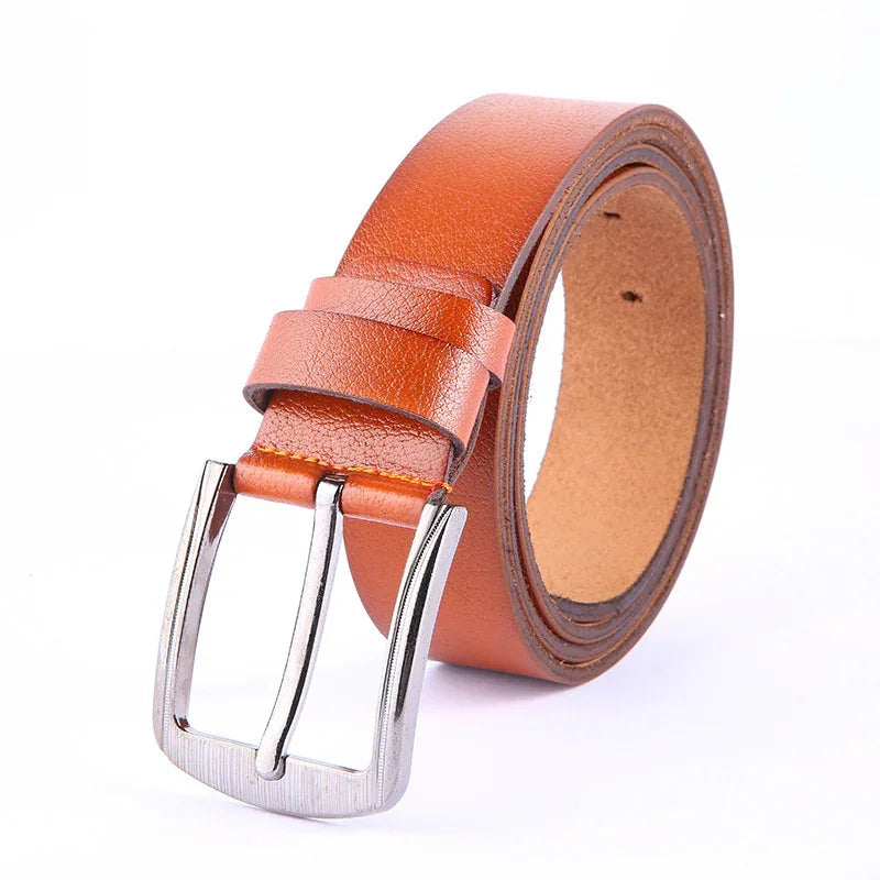 brown leather belt with silver metal buckle rolled up on white background