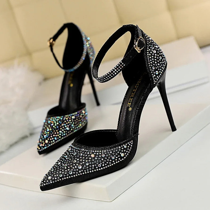 Elegant black high heel shoes with ankle straps and sparkling rhinestone embellishments
