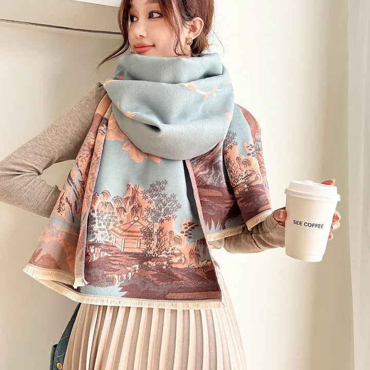 Woman wearing scenic printed scarf and beige pleated skirt holding white coffee cup