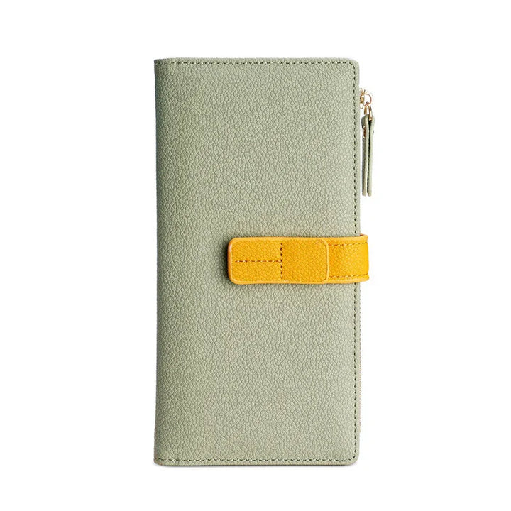 Light green textured leather wallet with yellow strap and zipper closure on white background