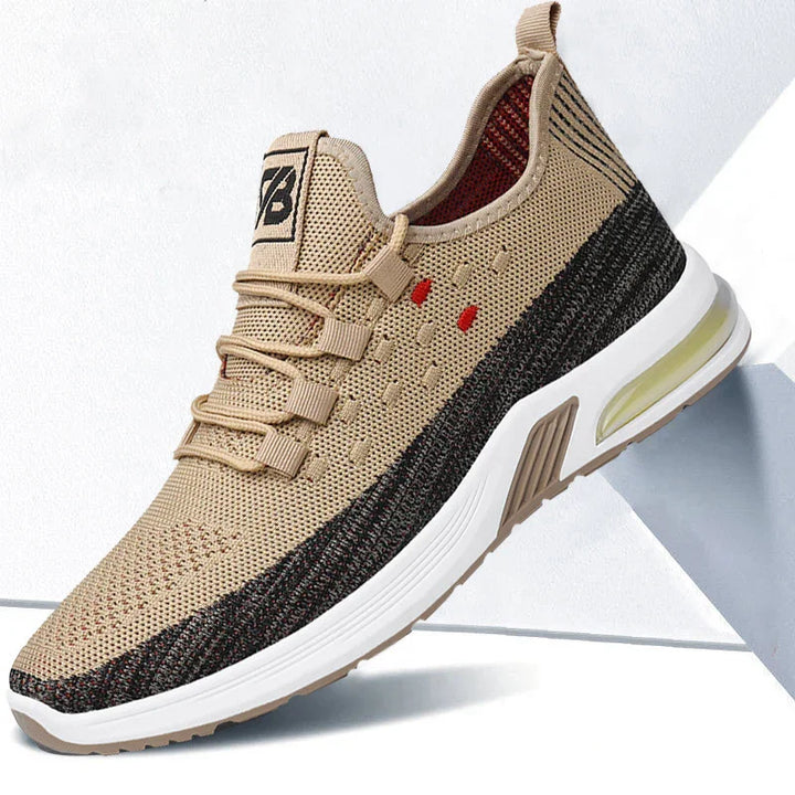 Beige and black athletic sneaker with breathable mesh upper and air-cushioned white sole