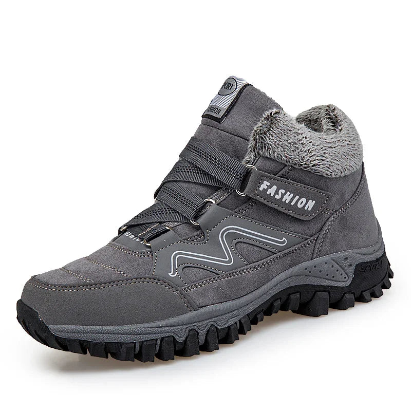 Gray high-top winter hiking shoe with fur lining, textured sole, and Velcro strap labeled Fashion