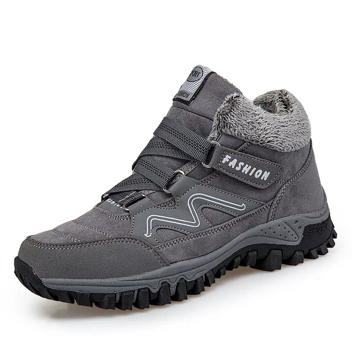 Gray high-top winter hiking shoe with fur lining, textured sole, and Velcro strap labeled Fashion