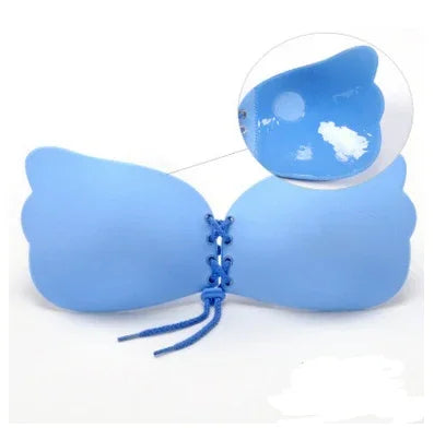 Blue strapless adhesive bra with lace-up front closure on white background