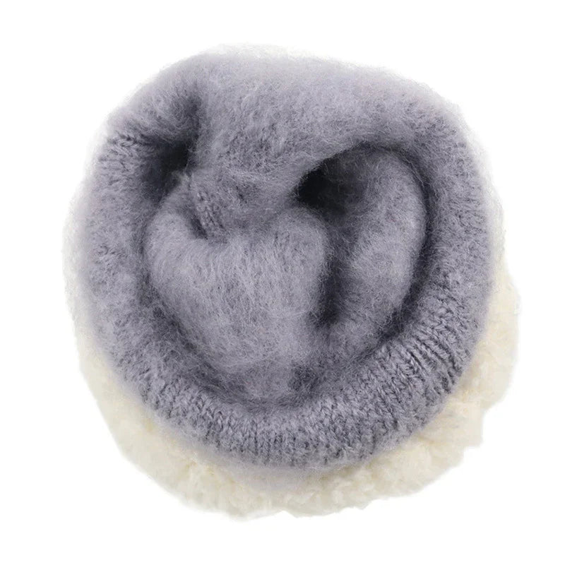 Cozy folded grey and white knitted wool beanie hat on white background