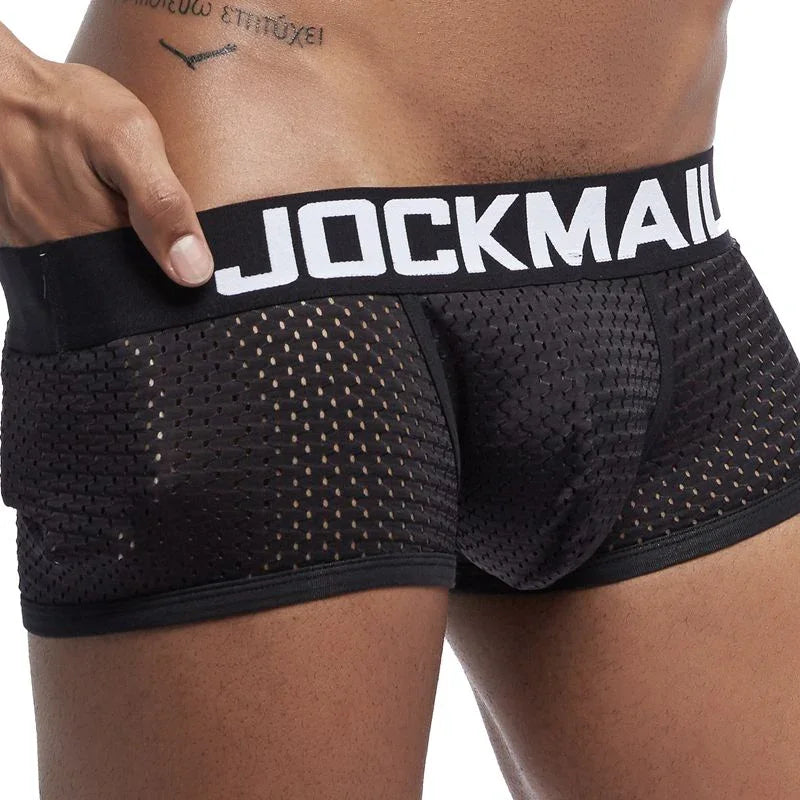 Close-up of man wearing black mesh JOCKMAIL waistband underwear, highlighting breathable fabric and fit