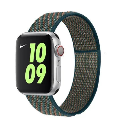 Apple Watch with silver case and Nike sport loop band in green and orange stripes