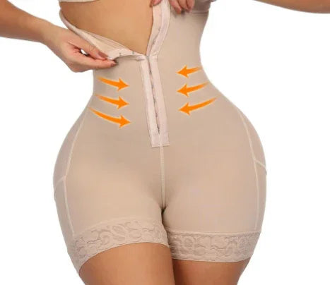 Woman wearing beige high-waisted waist trainer shorts with front zipper and orange compression arrows