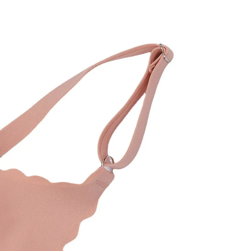 Light pink scalloped edge shoulder bag with adjustable strap and silver ring details