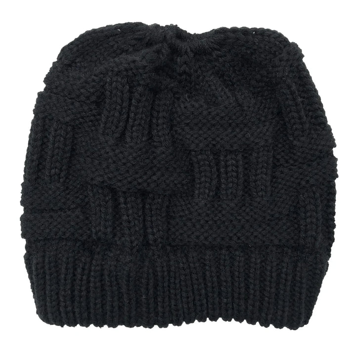 Black knitted winter beanie hat with a woven cable pattern and ribbed brim