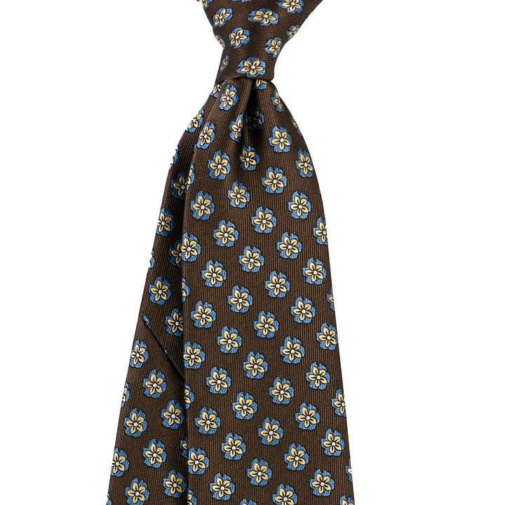 Brown silk necktie with blue and yellow floral pattern, classic men's fashion accessory