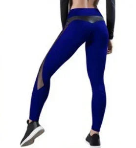 Woman wearing blue high-waisted leggings with black mesh accents, sports fitness wear
