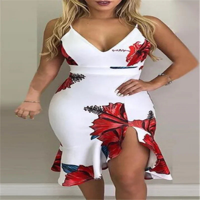 Woman wearing white bodycon dress with red floral print and thigh-high slit