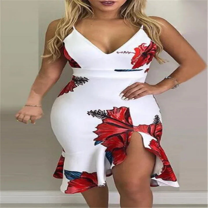 Woman wearing white bodycon dress with red floral print and thigh-high slit