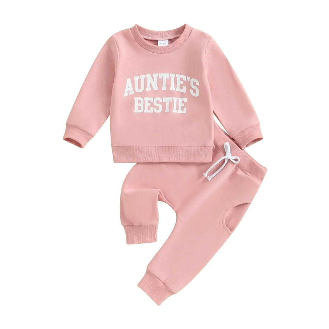 Pink baby clothing set with long-sleeve top reading Auntie's Bestie and matching jogger pants