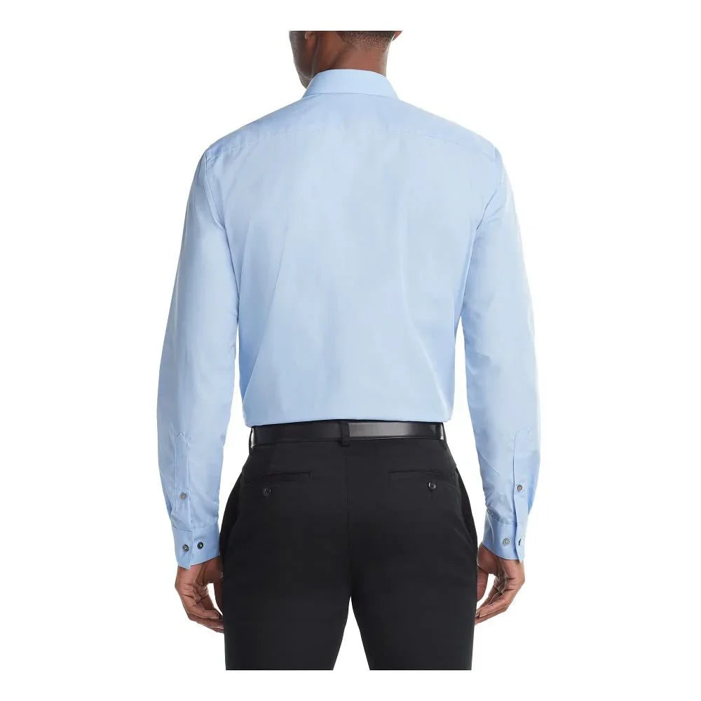 Back view of man wearing light blue dress shirt and black pants with black belt