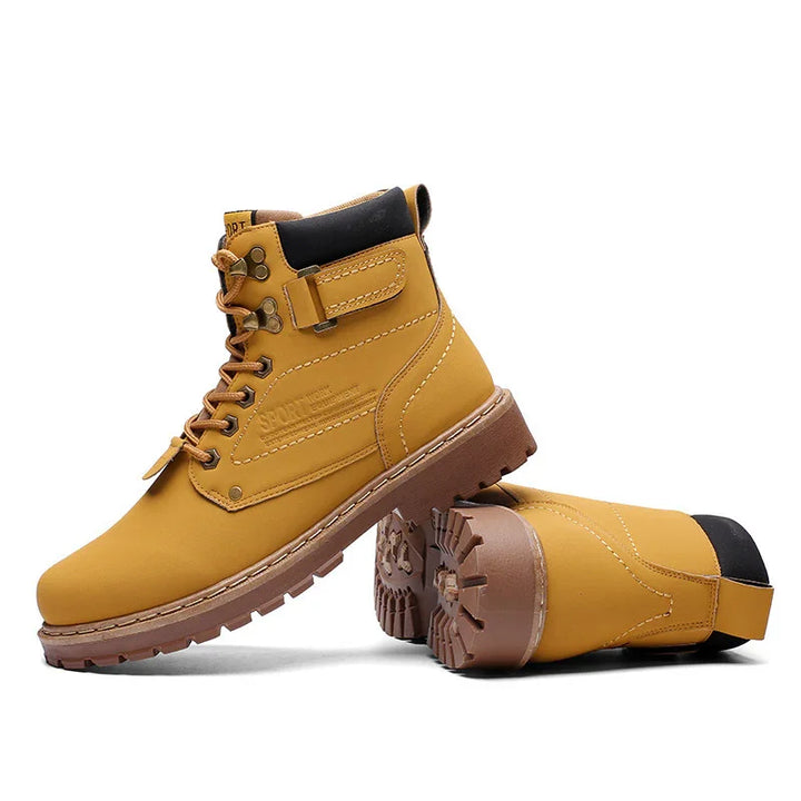 Yellow lace-up leather boots with brown soles and black padded collars, rugged outdoor style