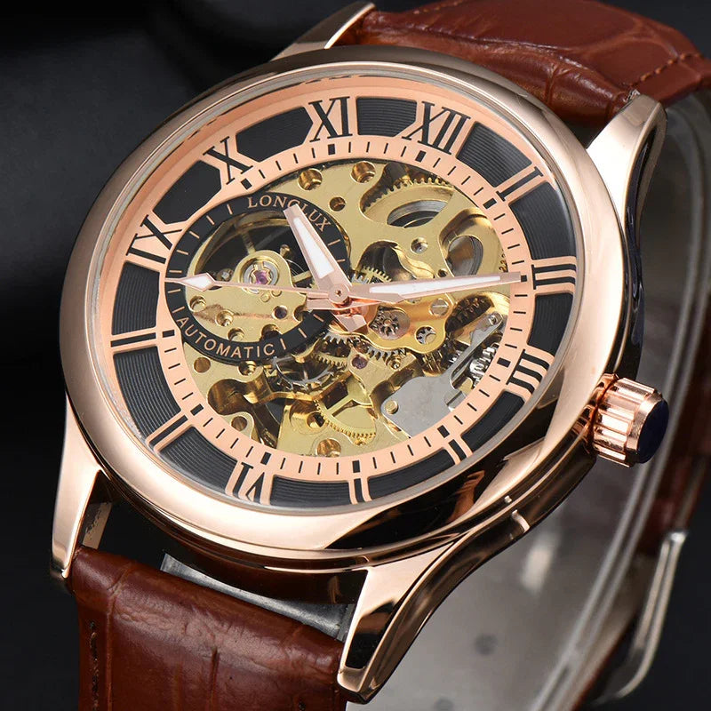 Rose gold automatic skeleton wristwatch with Roman numerals and brown leather strap