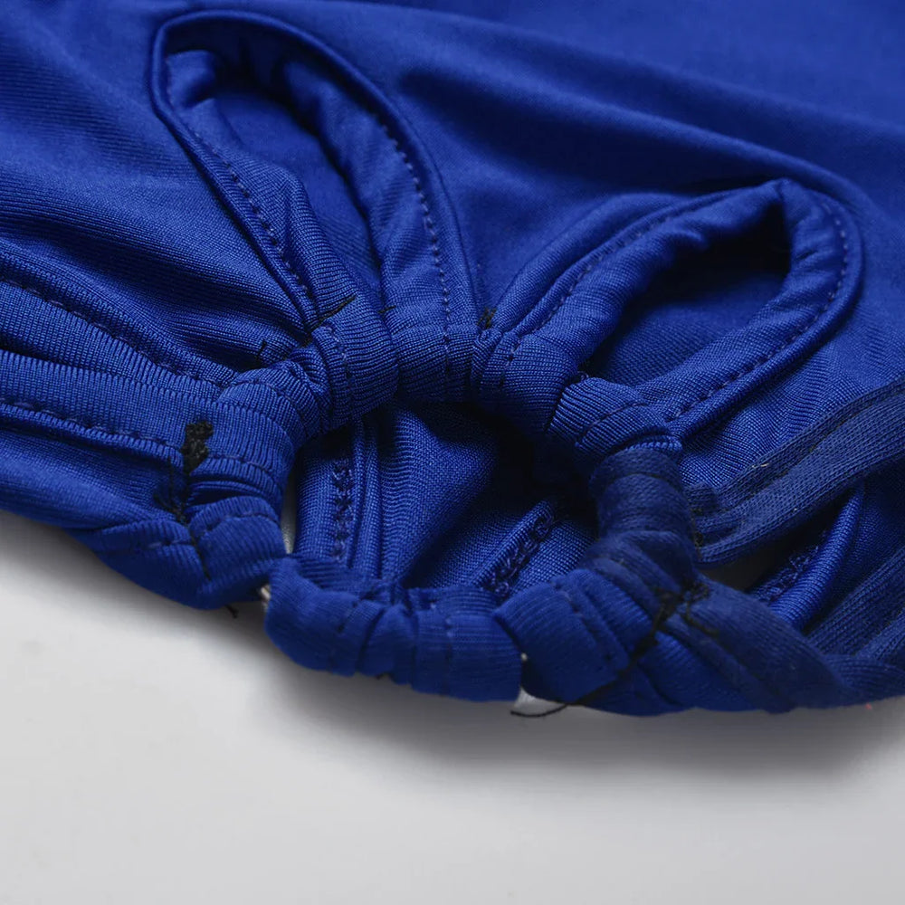 Close-up of blue elastic waistband with gathered fabric and detailed stitching on garment