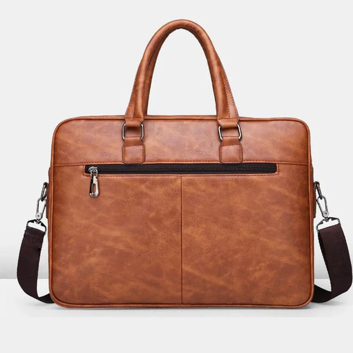 Brown leather laptop briefcase with handles, front zip pocket, and detachable shoulder strap