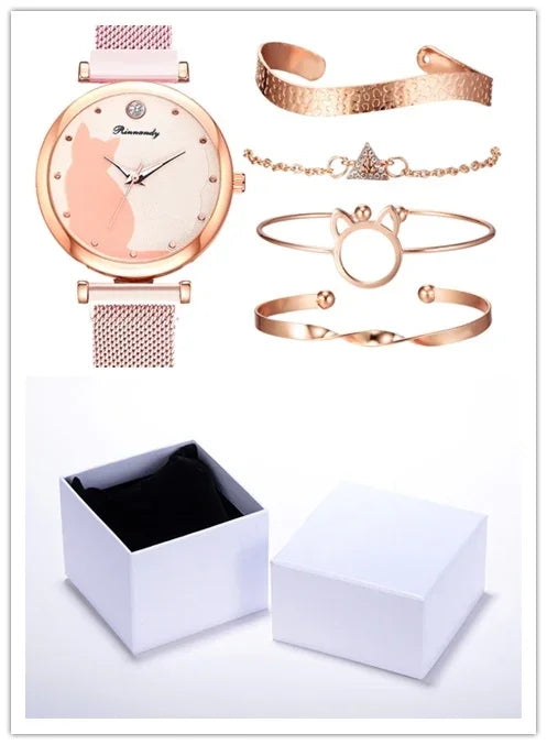 Rose gold women's watch with mesh strap and four matching rose gold bracelets, displayed with white gift box