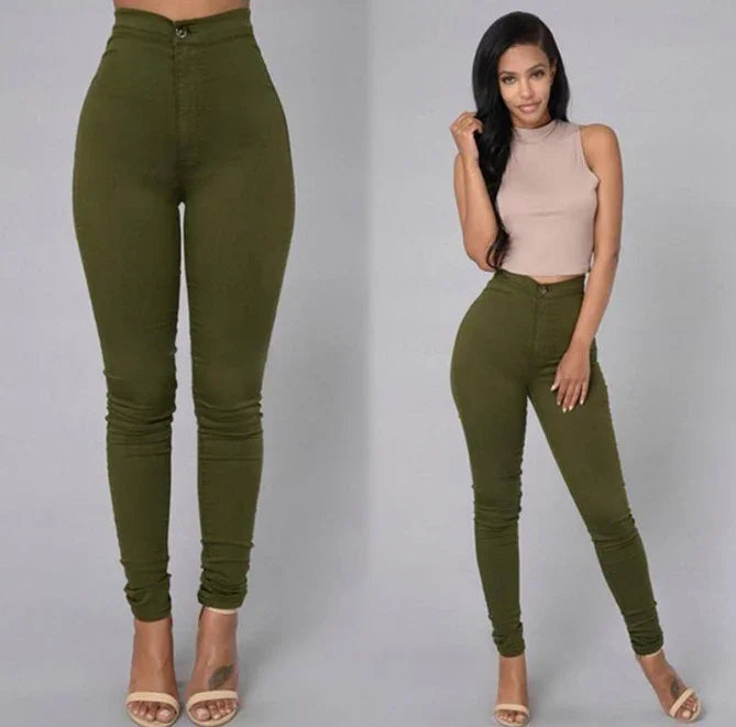 Woman modeling high-waisted olive green skinny pants with beige sleeveless crop top and nude heels