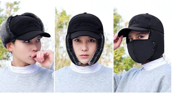 Black winter cap with ear flaps, built-in face mask, and adjustable design worn by a man outdoors