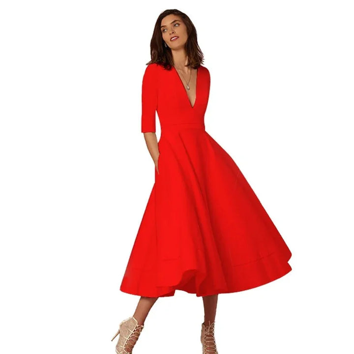 Woman wearing a vibrant red midi dress with deep V neckline and three-quarter sleeves