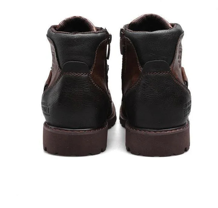 Back view of brown and black leather casual boots with sturdy rubber soles on white background