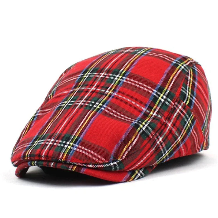 Red plaid flat cap hat with green, yellow, white, and blue tartan pattern on white background