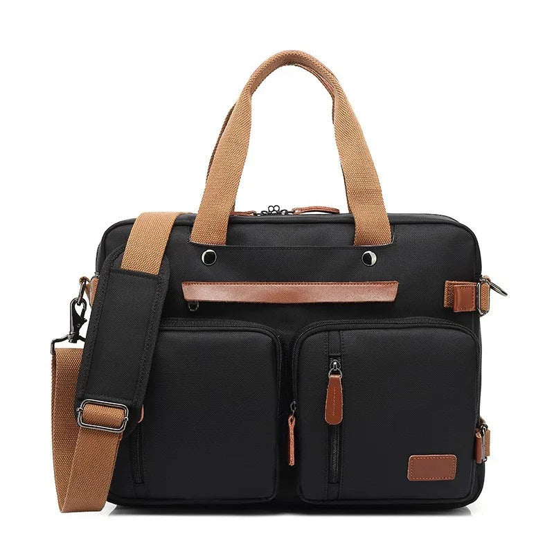 Black laptop bag with brown handles, leather accents, and front zippered pockets with adjustable shoulder strap