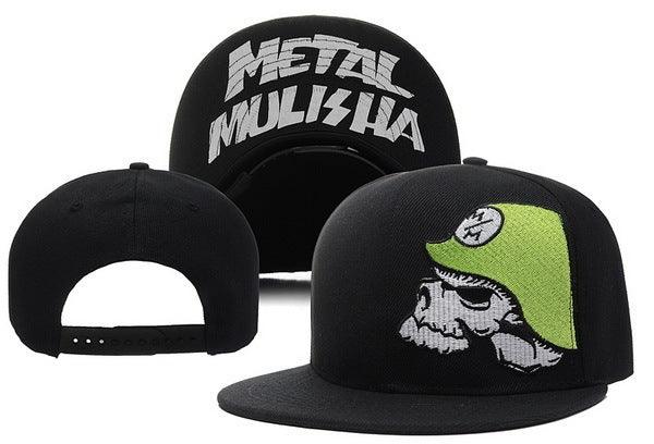 Black snapback cap with green helmet skull design on front and white Metal Mulisha logo embroidered inside