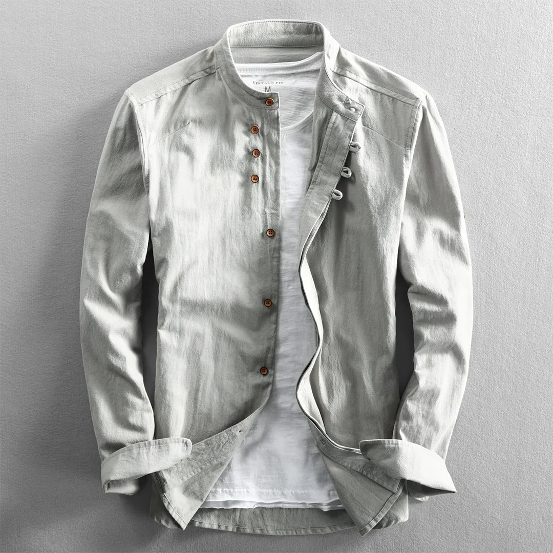 Light gray casual men's jacket with wooden buttons over white t-shirt on gray background