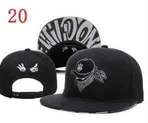 Black snapback cap with embroidered bandana skull design and contrasting white graphic under brim