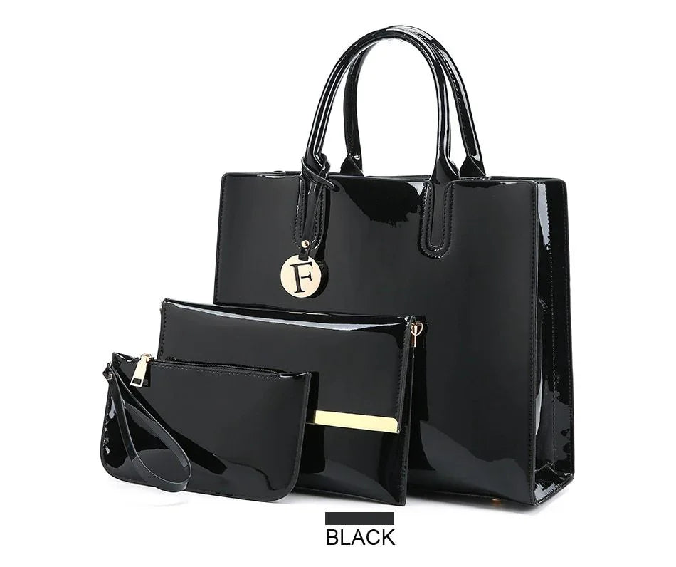 Black glossy handbag set with three pieces including a tote, clutch, and wristlet pouch