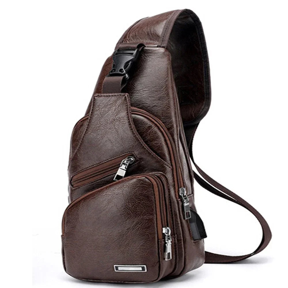 Brown leather sling bag with multiple zippered compartments and adjustable strap